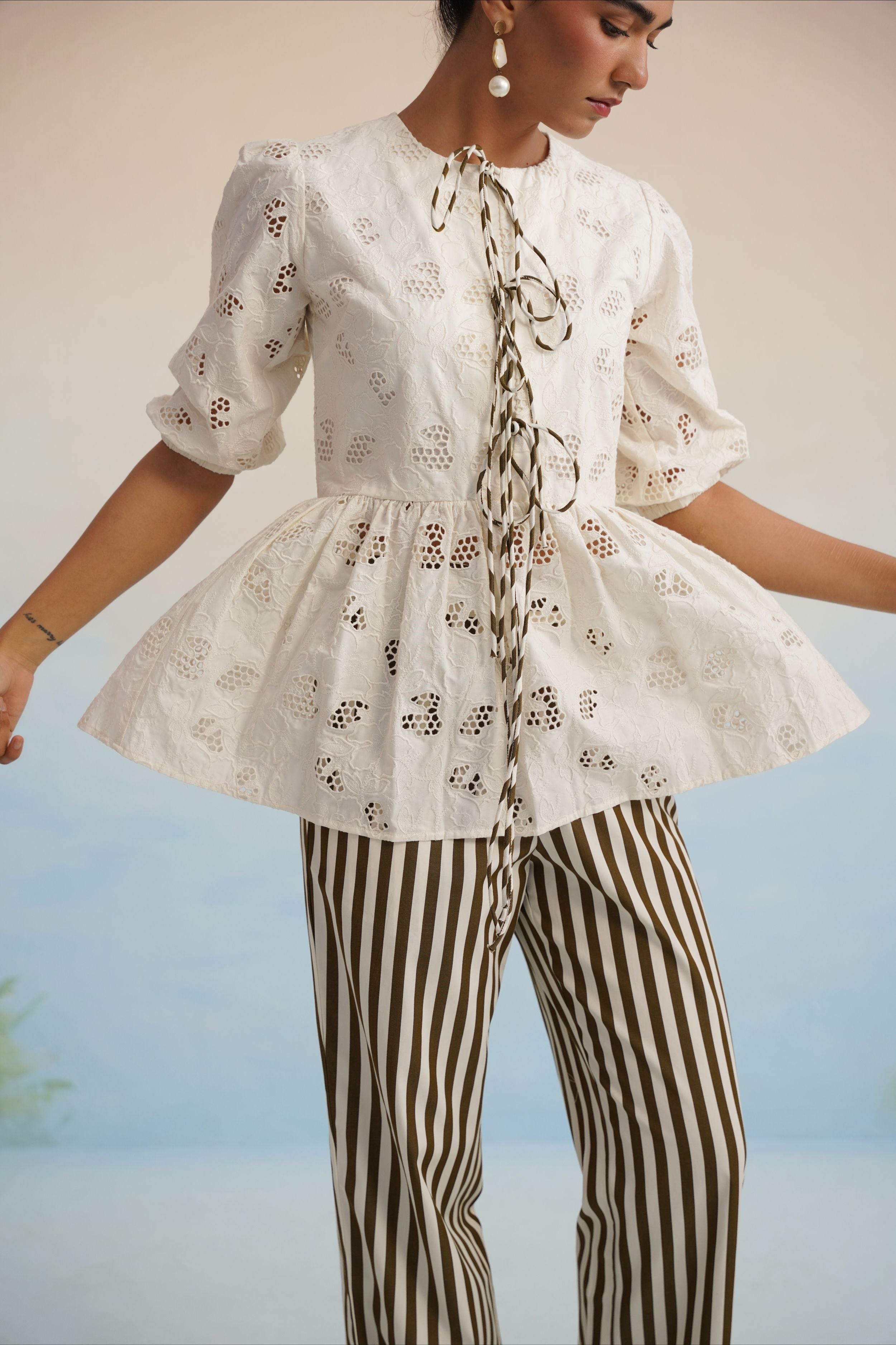 The Alora Broderie Peplum Blouse