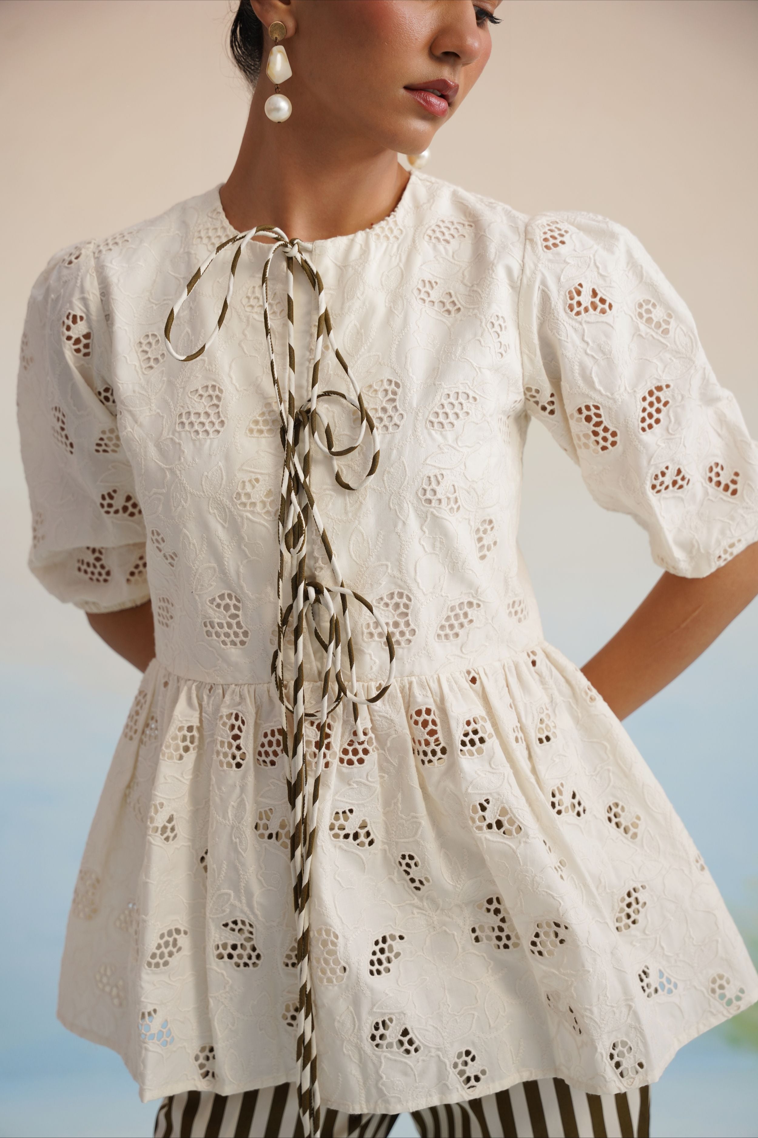 The Alora Broderie Peplum Blouse