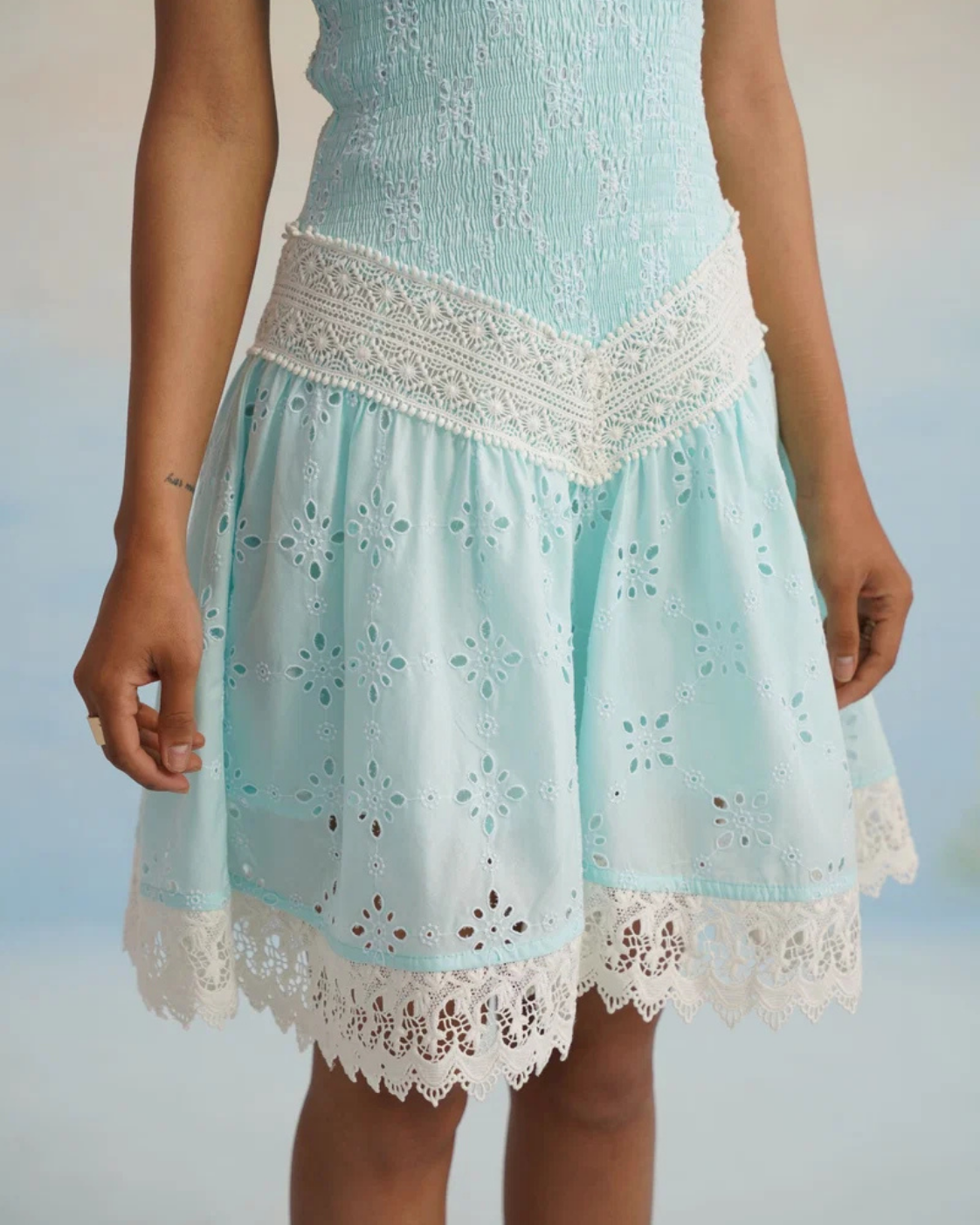 The Aqua Breeze Smocked Eyelet Mini Dress
