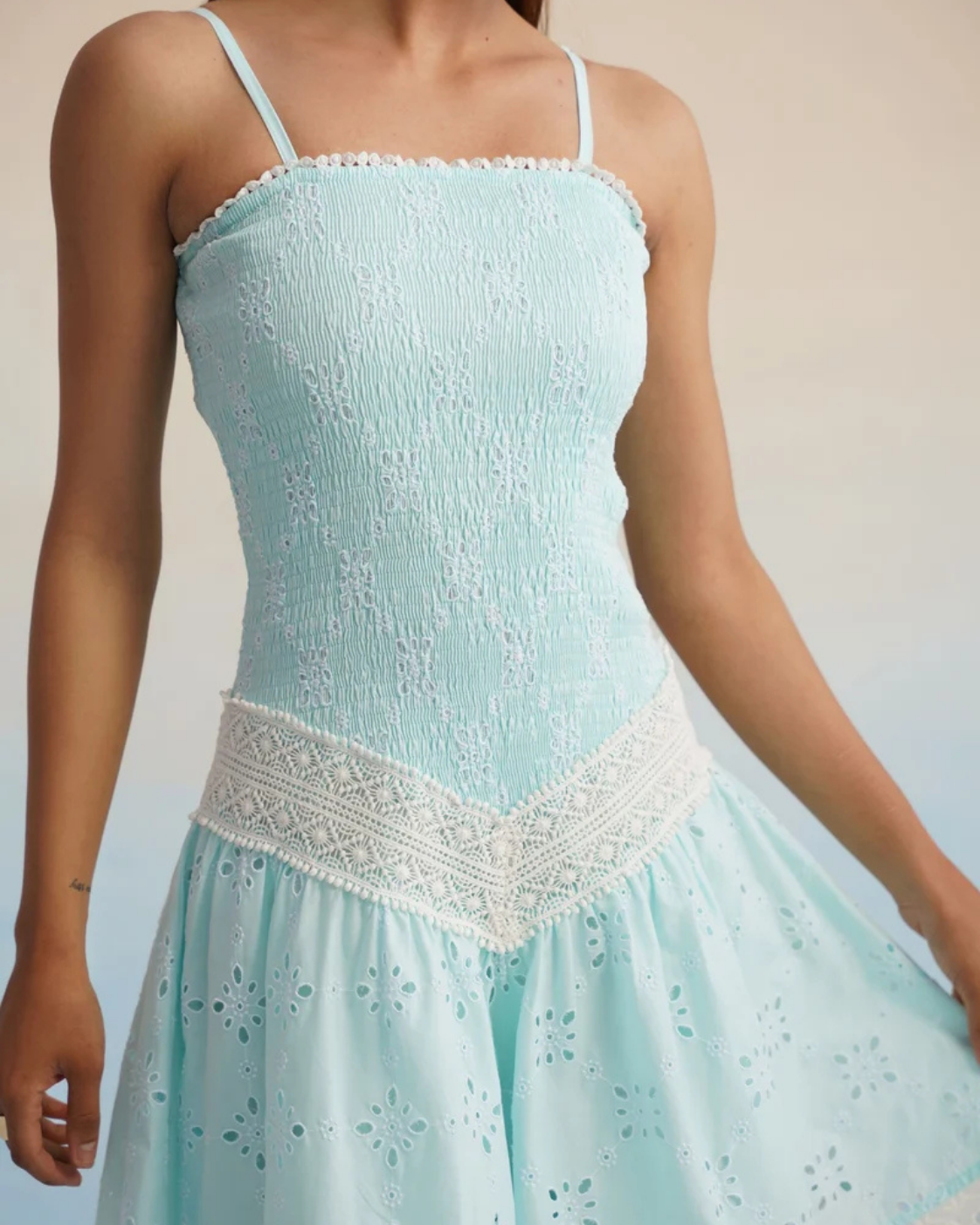 The Aqua Breeze Smocked Eyelet Mini Dress