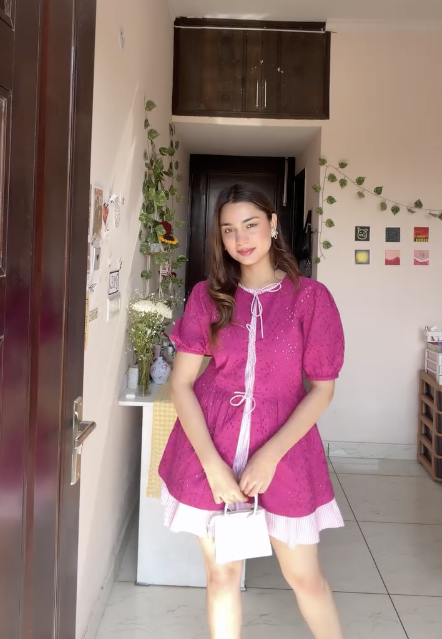 Jaskirat Kaur in The Valencia Fuchsia Eyelet Mini Dress